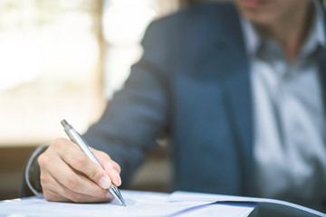 Close up of business man working at office.