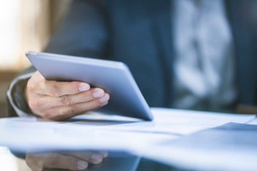 Close up of business man working at office.