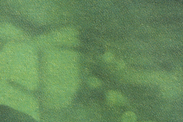 Image of green CMYK dots on newsprint