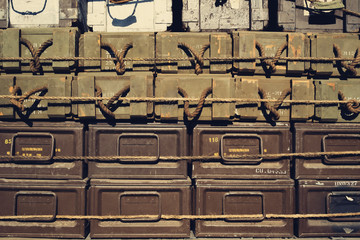 Military supply cases stacked on a truck