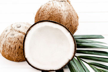 half coconut isolated on white wooden background