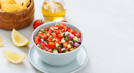 Homemade pico de gallo with tomatoes, peppers, jalapenos and red onions.