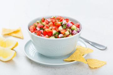 Homemade pico de gallo with tomatoes, peppers, jalapenos and red onions.