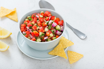 Homemade pico de gallo with tomatoes, peppers, jalapenos and red onions.