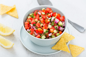 Homemade pico de gallo with tomatoes, peppers, jalapenos and red onions.