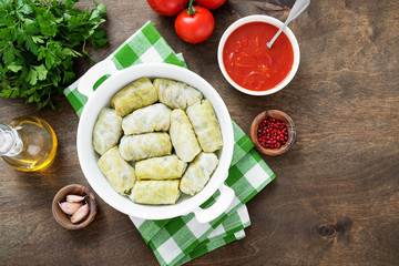 Traditional stuffed cabbage rolls with minced meat and rice, served in a tomato sauce.