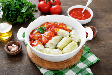 Traditional stuffed cabbage rolls with minced meat and rice, served in a tomato sauce.