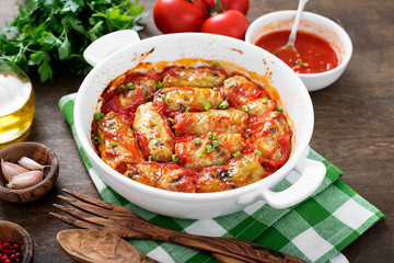 Traditional stuffed cabbage rolls with minced meat and rice, served in a tomato sauce.