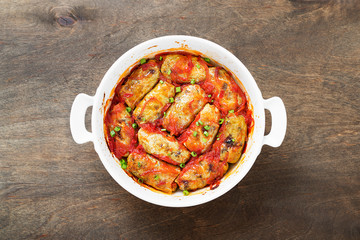 Traditional stuffed cabbage rolls with minced meat and rice, served in a tomato sauce.