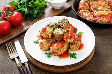 Traditional stuffed cabbage rolls with minced meat and rice, served in a tomato sauce.