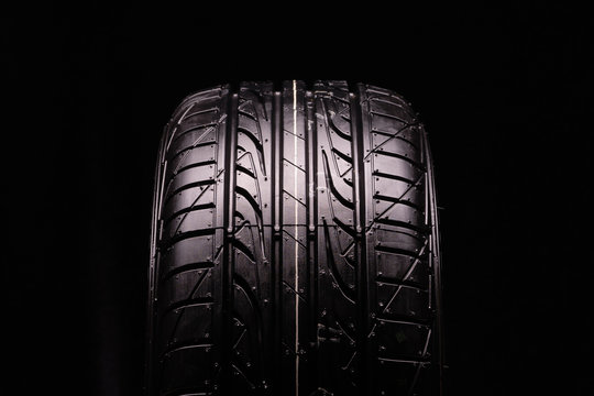 new summer tire, tire tread. Close-up, black background
