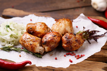 Grill bar, tasty chicken meat. Shish kebab with marinated onions garnishing on wooden board. Summer delicious food, weekend bbq party, picnic food