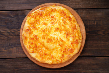 Traditional Georgian meal. Megrelian Khachapuri with Melted Cheese filling.