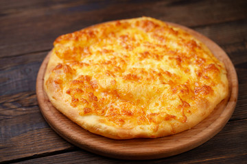 Traditional Georgian meal. Megrelian Khachapuri with Melted Cheese filling.