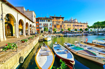 View of Desenzano del Garda at the lakeside of Lake Garda in summer. - obrazy, fototapety, plakaty