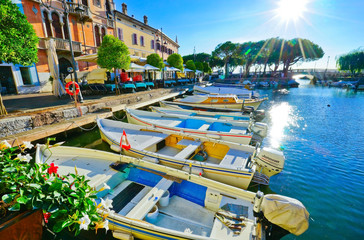 View of Desenzano del Garda at the lakeside of Lake Garda in summer.