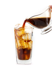 coffee pouring into glass of ice