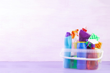 Cleaning service concept. Colorful cleaning set for different surfaces in kitchen, bathroom and...