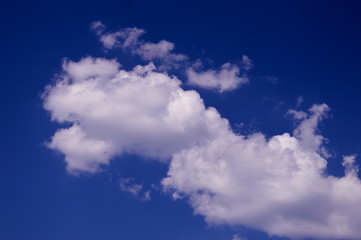Naklejka na ściany i meble Clouds in the blue sky - Background