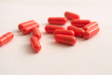 Red capsule. Medical prescription pills