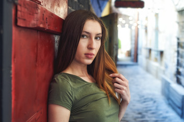 Obraz premium Portrait of young girl in old town , girl in casual clothes