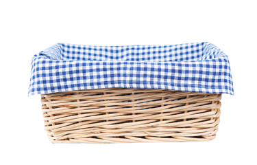 Straw basket with blue checkered towel cloth isolated.