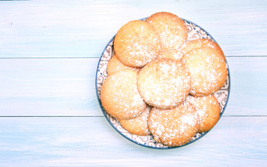 Bisquits on plate top view,cookies on wooden empty space  background.