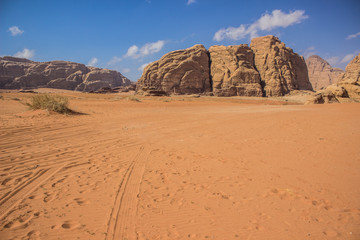 Fototapeta na wymiar Wadi Rum Jordanian desert with sand stone rocks and dunes scenery landscape national heritage destination place for tourists and sightseeing tours 