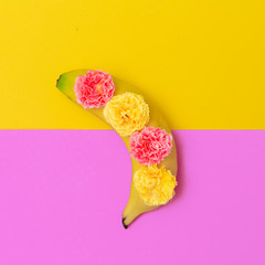 Banana in flowers. Minimal flat lay fruits art