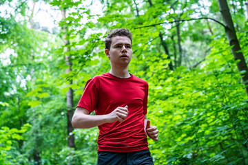 Naklejka na ściany i meble Healthy lifestyle - young man running