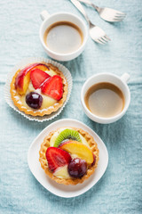Mini tarts with cream and mix of summer fruit