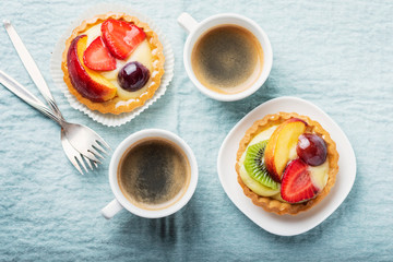 Mini tarts with cream and mix of summer fruit