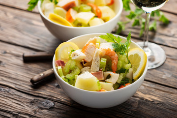 salad with seafood, potato and celery