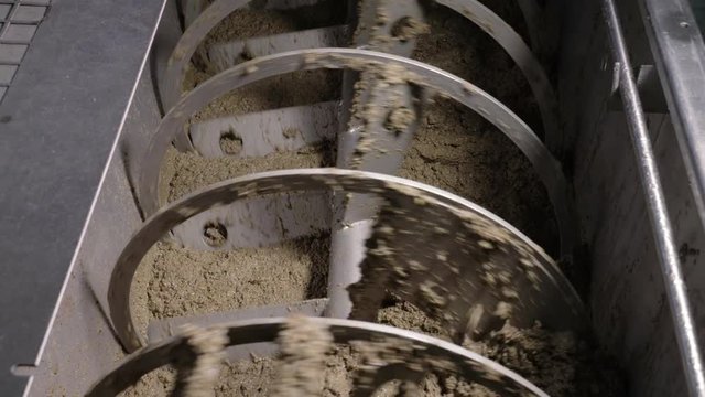 machinery pressing olives. Olive Oil production in South of Italy