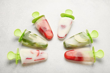 Sweet homemade dessert, popsicles (sorbet) for summer coolness. Frozen juice and ice cream.