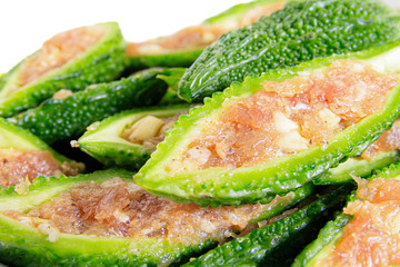 Close up bitter gourd pile with stuffed hack pork and garlic black pepper ingredient. vegetable herb Nourish the health body. Thai food