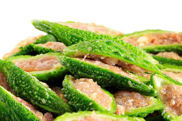 Close up bitter gourd pile with stuffed hack pork and garlic black pepper ingredient. vegetable herb Nourish the health body. Thai food