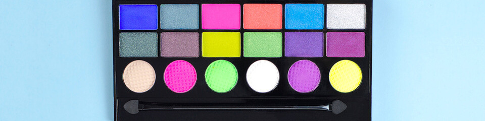 Neon palette of shadows on a blue background.