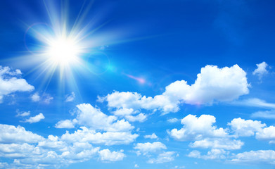 Naklejka na ściany i meble Sunny background, blue sky with clouds and sun