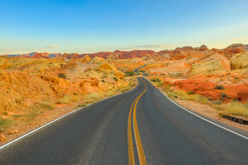 Fototapeta na wymiar The scenic colorful drive Rainbow Vista Road inside the Valley of Fire at sunset. Valley of Fire is Nevada's oldest state park located in Mojave Desert, 58 miles of Las Vegas, Unites States.