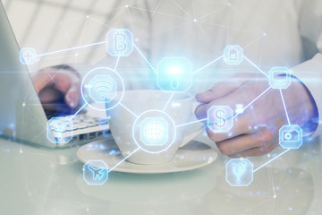 Social network theme hologram with businessman working on computer on background. Multi exposure.