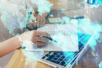 International business hud over woman's hands writing background. Concept of hard work. Double...