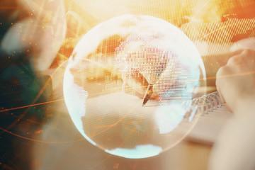 International business hud over woman's hands writing background. Concept of hard work. Double...