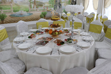 Wedding dinner table with plates of food