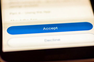 Accept button on smartphone app screen closeup