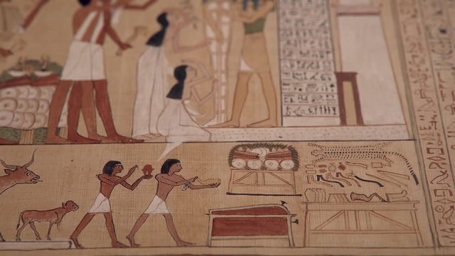 Opening of the Mouth Ceremony, GI of an ancient Egyptian papyrus paper, tilt up shot, shallow depth of field.