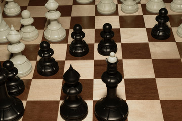 Chessboard with black chessmen for hobby backdrop