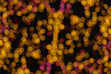 Small abstract blurred and bokeh of reflection lighting of led light bubs on black background.