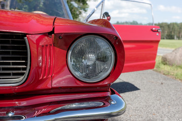 Detail view of the headlight. Retro car. Front light