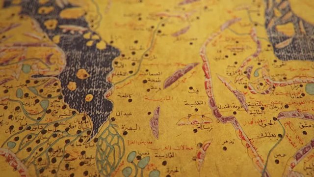 Al-Idrisi's Tabula Rogeriana Middle East Map created in 1154, the most advanced medieval world maps, shallow depth of field close-up slow tilt up CGI shot.